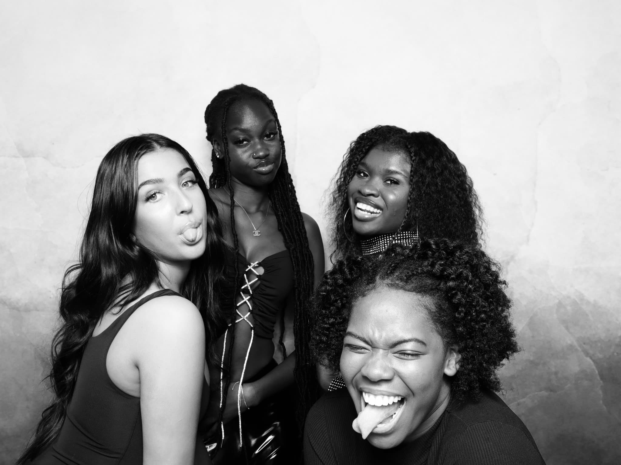 B&W group portrait — playful poses